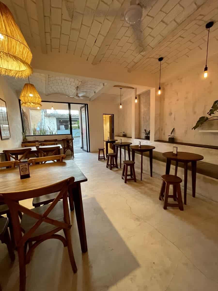 Anchor Cafe interior with wooden tables in Sayulita