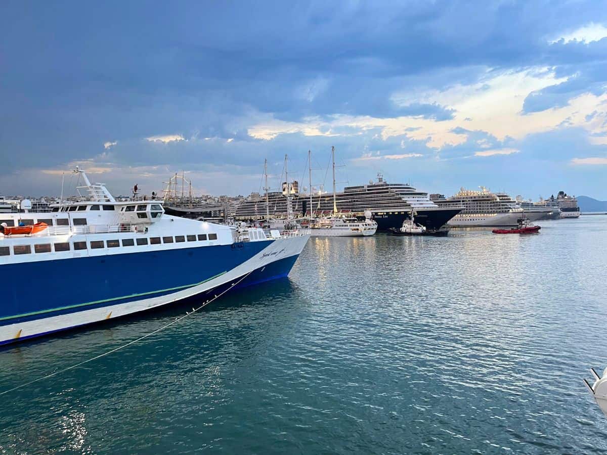Cloudy sky in Athens with 3 ferries in the water