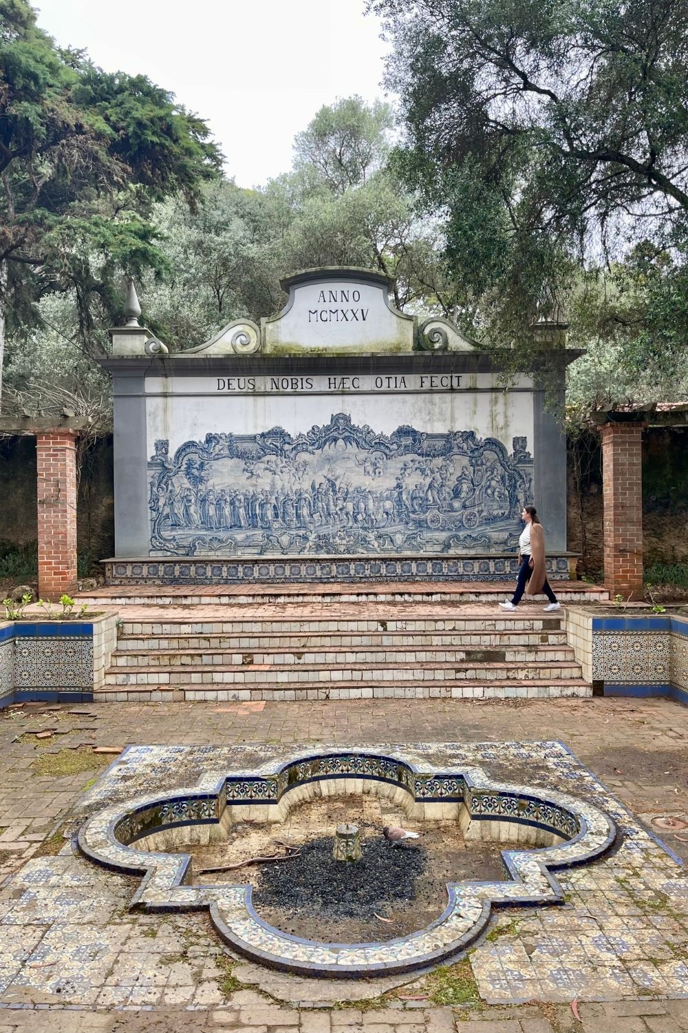 A woman walking alone in a park in Cascais, Portugal. 