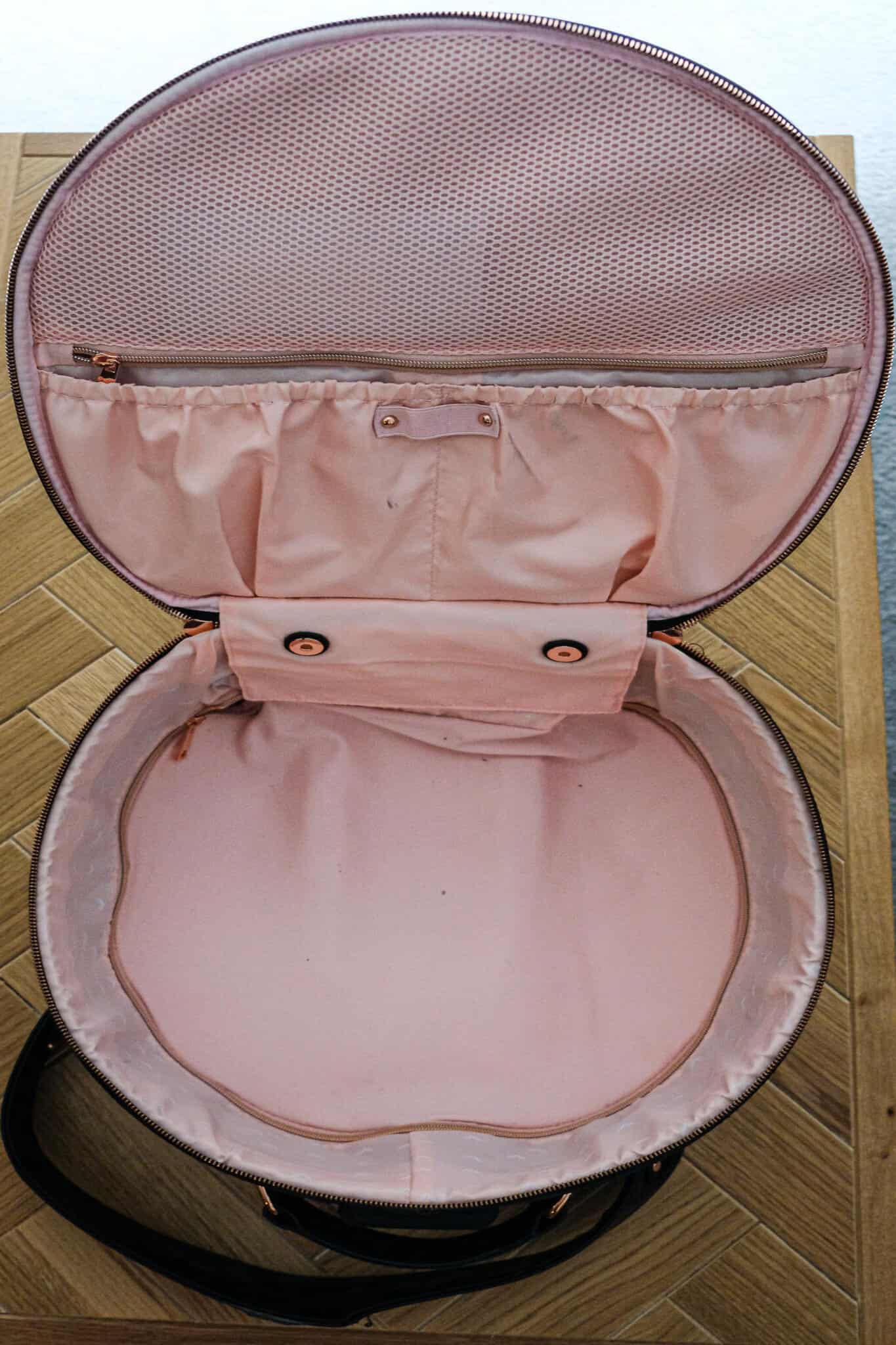 Smart Birdy Luggage Review. Round black suitcase opened on a wooden floor.