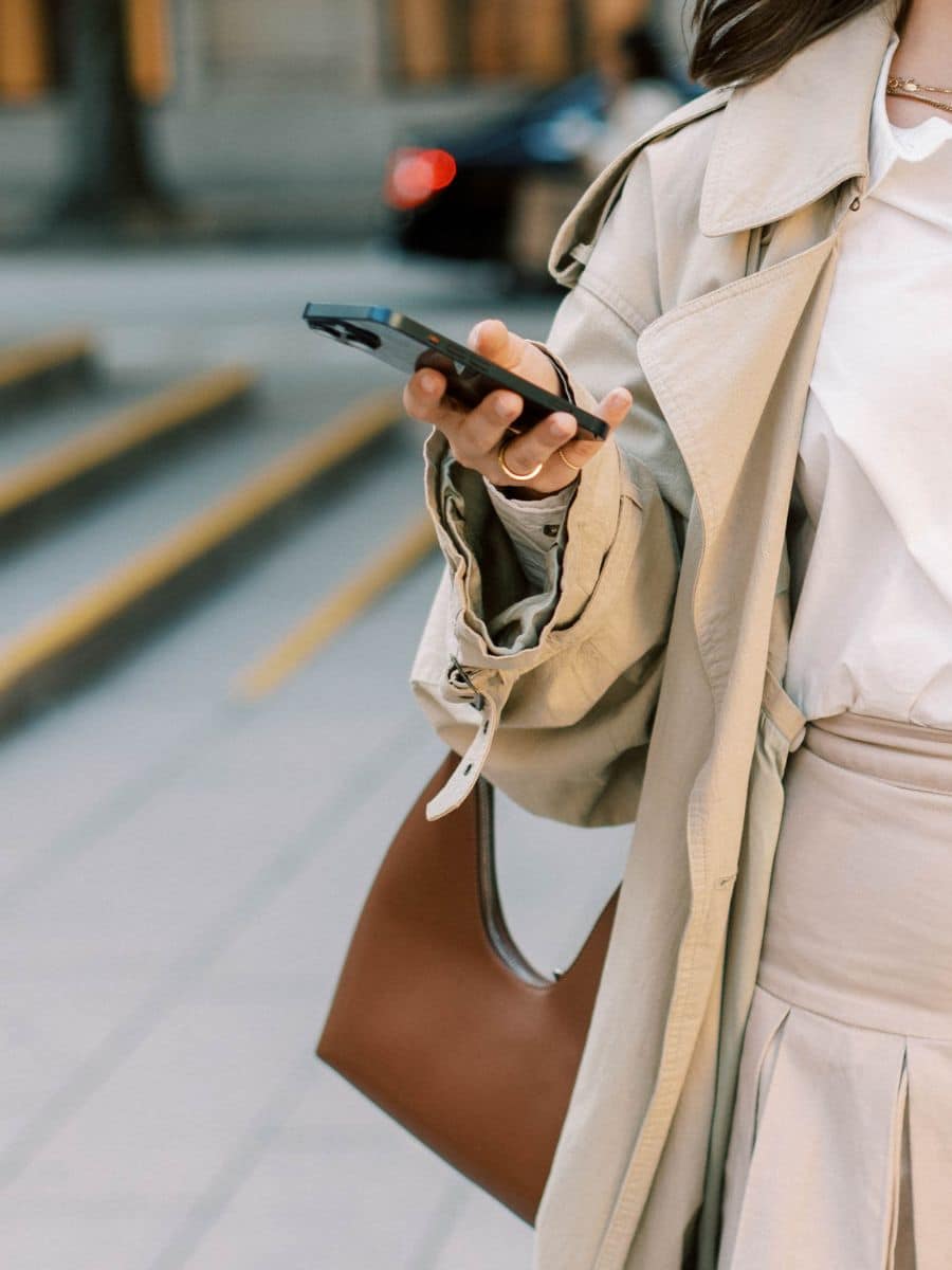 Woman looking at cell phone for directions