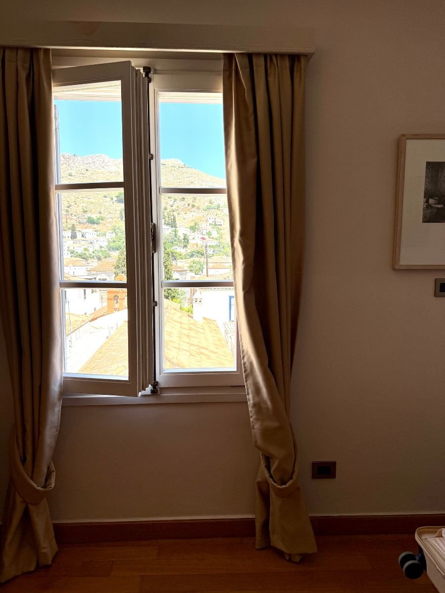 A window with the view of Hydra from Leto Hotel.