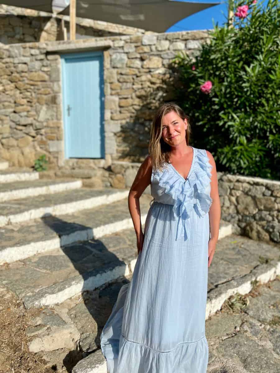 Woman in a blue dress in Mykonos.