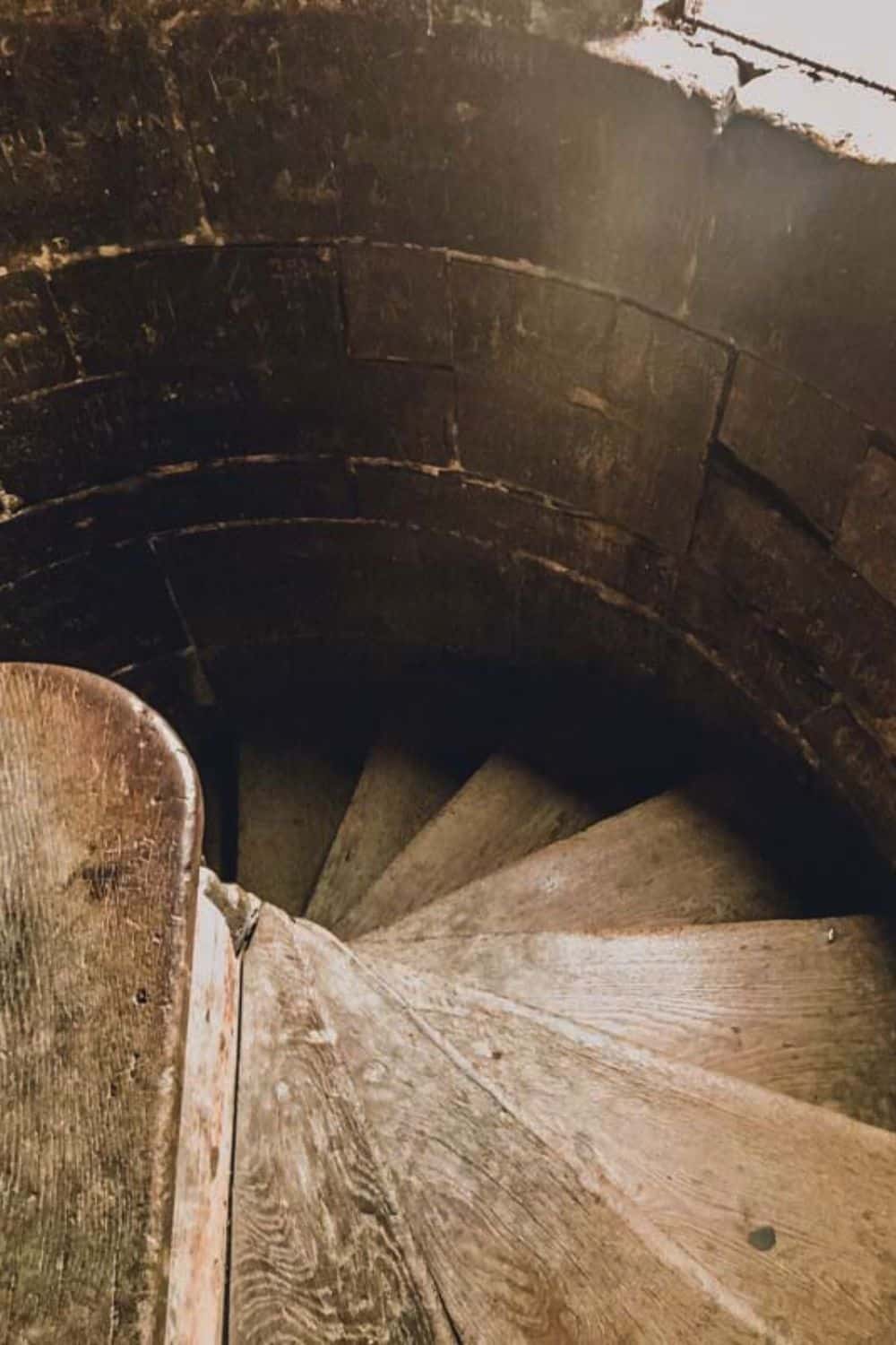 Spiraling wooden staircase in a Sibiu historical building