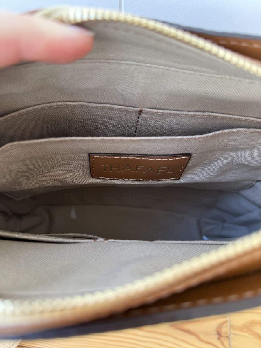Interior view of the bag showcasing multiple compartments and a clean, organized layout.