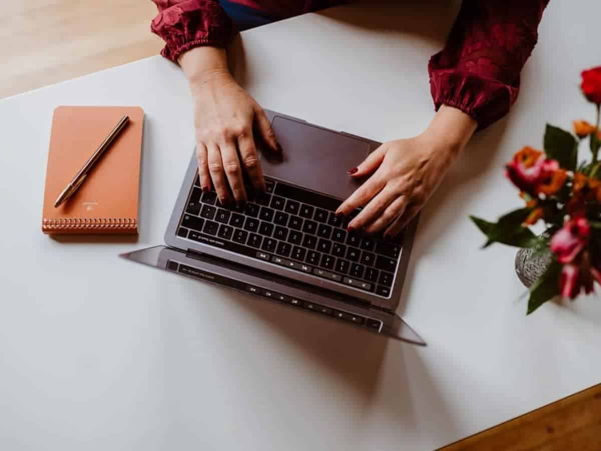 Womens hands typing on a computer