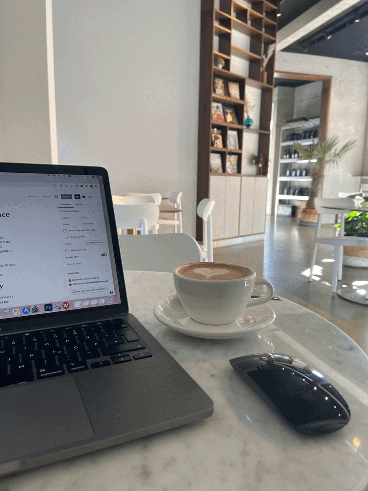 Coffee and laptop on a table in Black Apron, one of the best cafes to work in Berlin.